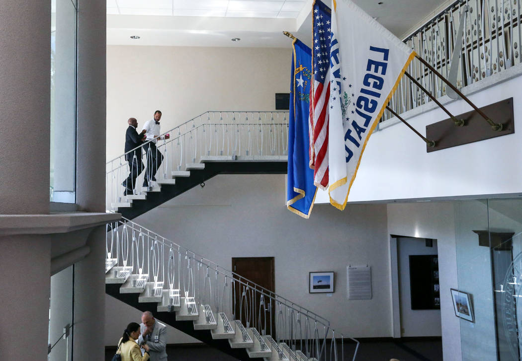 Nevada Senate Democrats Kelvin Atkinson, top left, and Aaron Ford work in the final hours of the session at the Legislative Building in Carson City, Nev., on Monday, June 1, 2015. (Cathleen Alliso ...