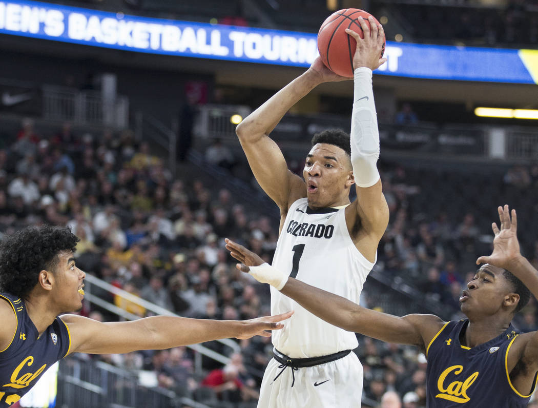 Colorado sophomore guard Tyler Bey (1), a Las Vegas native, grabs a rebound over California sophomore guard Juhwan Harris-Dyson (2) and freshman forward Andre Kelly (22) in the second half during ...