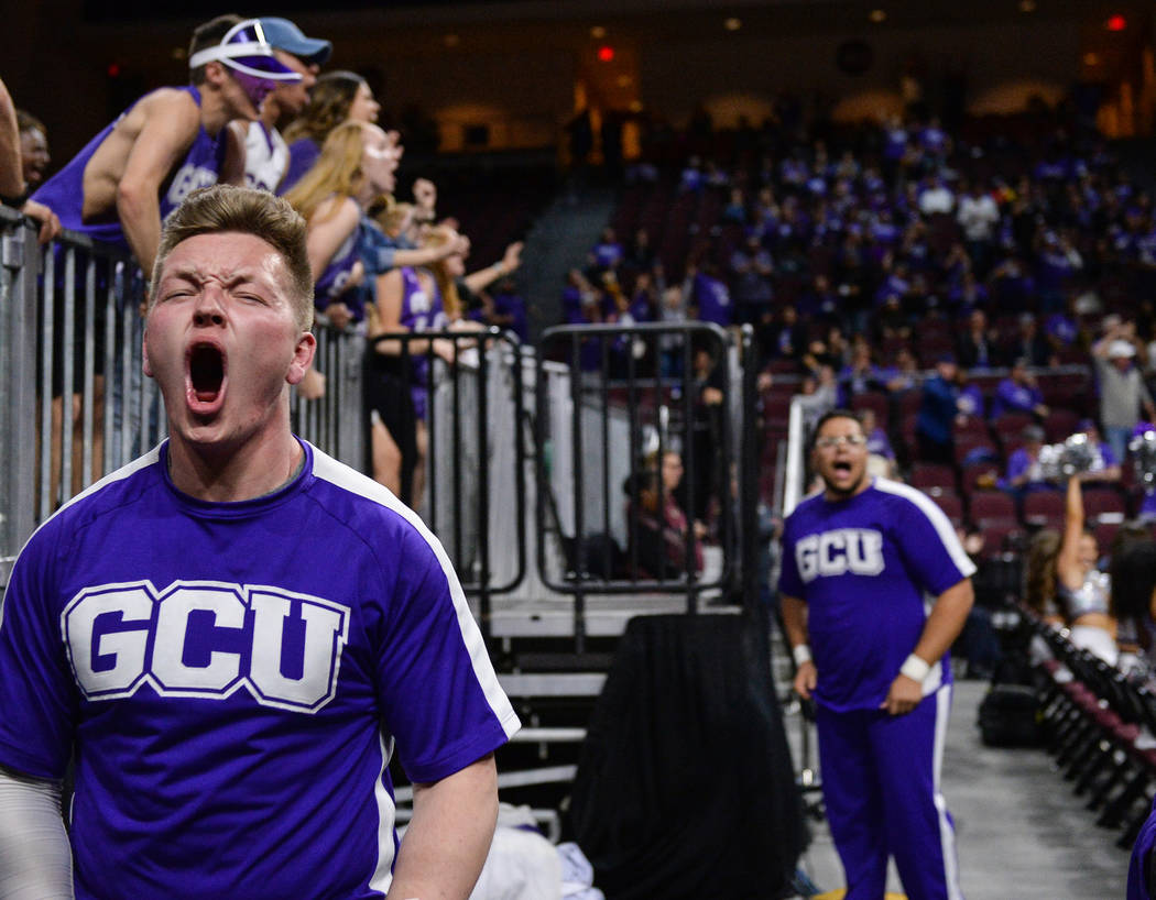 Grand Canyon University student Grayson Higgins cheers on the team in the second half of the opening round of the Western Athletic Conference tournament against Seattle University in Las Vegas, Th ...