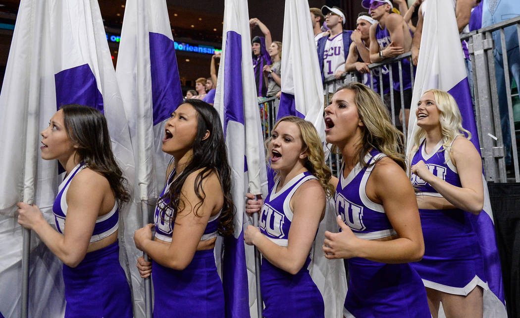 Cheerleaders in the Grand Canyon University student section cheer on their team in the second half of the opening round of the Western Athletic Conference tournament against Seattle University in ...