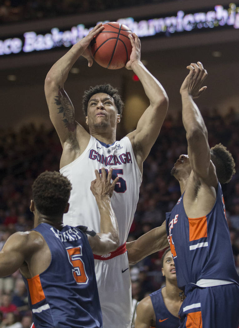 Gonzaga junior forward Brandon Clarke (15) grabs a rebound over Pepperdine sophomore guard Jade' Smith (5) in the first half during the West Coast Conference semifinal game on Monday, March 11, 20 ...