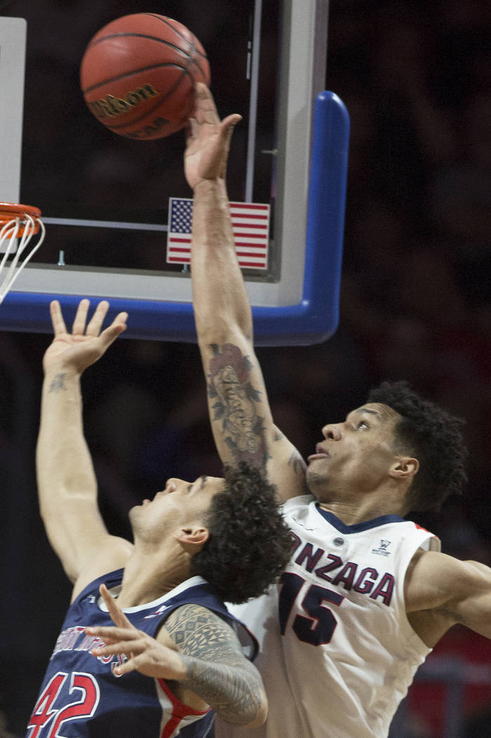 Gonzaga junior forward Brandon Clarke (15) blocks the shot of Saint Mary's freshman forward Dan Fotu (42) in the first half during the West Coast Conference finals game on Tuesday, March 12, ...