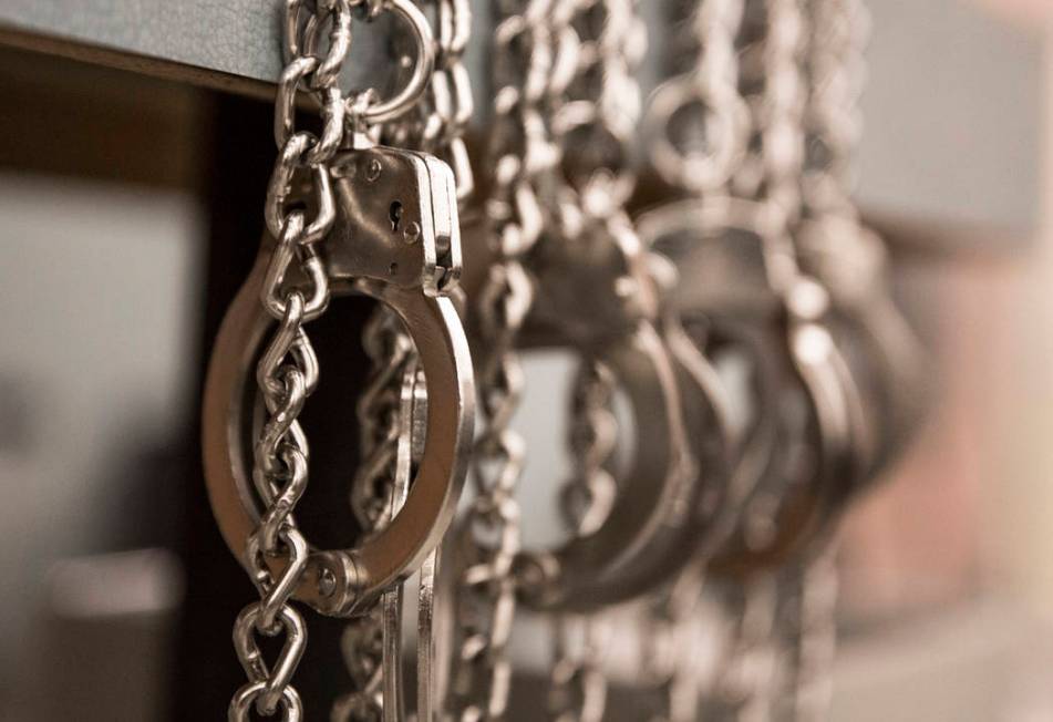 A row of handcuffs hang at the Metro Traffic Bureau during a Metro "DUI blitz" event on Thursday, March 14, 2019, in Las Vegas. (Benjamin Hager Review-Journal) @BenjaminHphoto