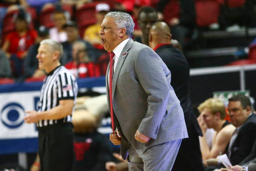 UNLV Rebels head coach Marvin Menzies reacts during the first half of a quarterfinal game against San Diego State in the Mountain West men's basketball tournament at the Thomas & Mack Center i ...