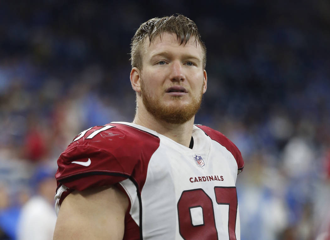 Former Arizona Cardinals defensive end Josh Mauro stands near the sideline during the team's NFL football game against the Detroit Lions in Detroit on Sept. 10, 2017. (AP Photo/Duane Burleson, File)