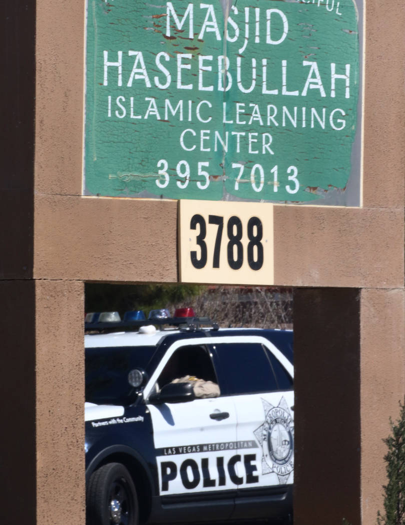 A Metro Police officer sits in his patrol vehicle outside the Masjid Ibrahim on Friday, March 15, 2019, in Las Vegas. Bizuayehu Tesfaye Las Vegas Review-Journal @bizutesfaye