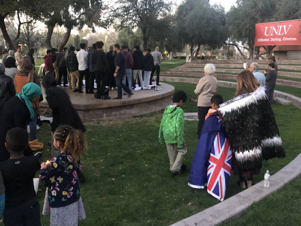 Rata Elmore stands with her 8-year-old son, Aramoana, while people prepare to pray at a vigil on Friday, March 15, 2019. (Katelyn Newberg/ Las Vegas Review-Journal)