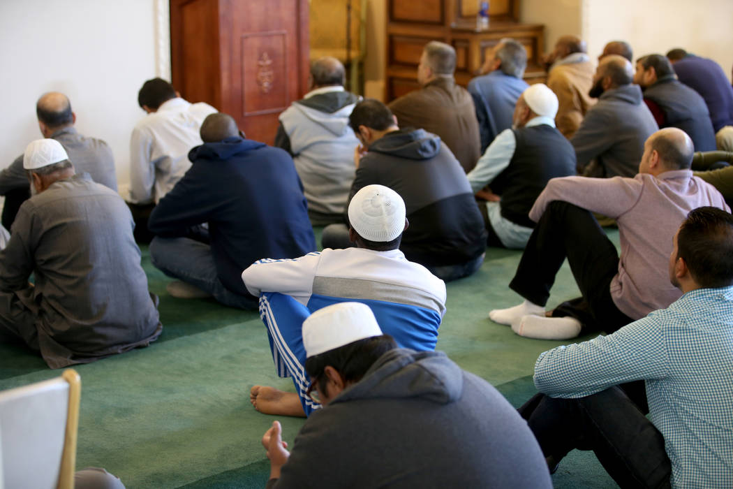 Worshipers listen to Shaykh Obair Katchi, Imam of Corona Masjid in California, during a prayer service at the Mosque of Islamic Society of Nevada in Las Vegas Friday, March 15, 2019. (K.M. Cannon/ ...