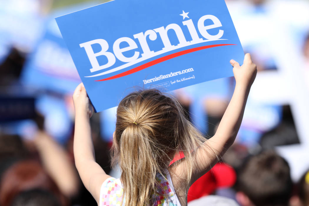 A young girl holds up a sign supporting Democratic presidential candidate Sen. Bernie Sanders at a rally in Morrell Park in Henderson on a tour to launch his presidential campaign, Saturday, March ...