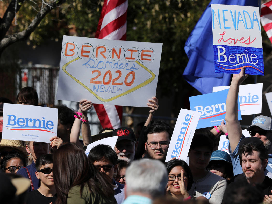 Supporters of Democratic presidential candidate Sen. Bernie Sanders' campaign hold up their posters at a rally at Morrell Park in Henderson, Saturday, March 16, 2019. (Heidi Fang /Las Vegas Review ...