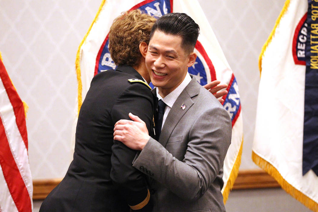 Anthony Hua embraces U.S. Army Lt. Gen. Nadja West after getting sworn in as captain for the U.S. Army Reserve during a ceremony at the Hampton Inn Tropicana and Event Center in Las Vegas, Friday ...