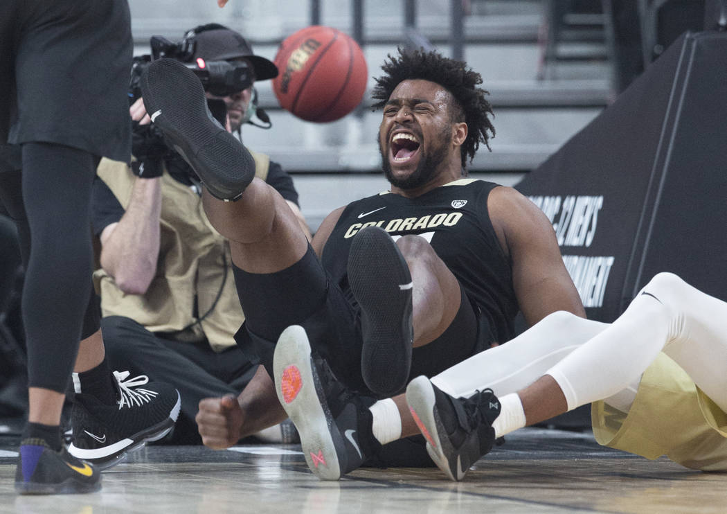 Colorado freshman forward Evan Battey (21) celebrates after taking a charge during the the Buffalos Pac-12 tournament semifinal game with Washington on Friday, March 15, 2019, at T-Mobile Arena, i ...