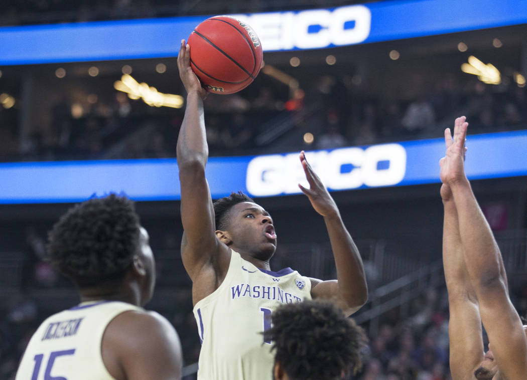 Washington sophomore forward Nahziah Carter (11) drives past a Colorado defender in the second half during the Huskies semifinal game of the Pac-12 tournament on Friday, March 15, 2019, at T-Mobil ...