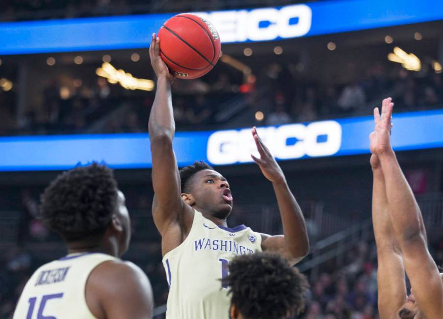 Washington sophomore forward Nahziah Carter (11) drives past a Colorado defender in the second half during the Huskies semifinal game of the Pac-12 tournament on Friday, March 15, 2019, at T-Mobil ...