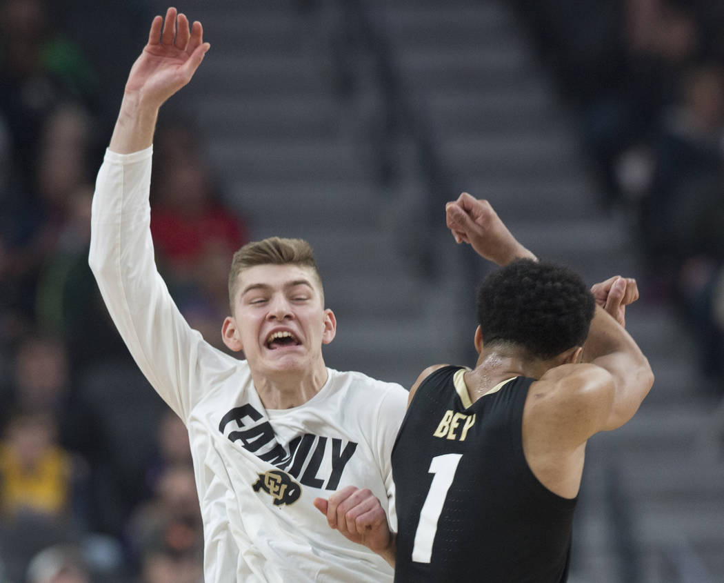 Colorado sophomore guard Tyler Bey (1) celebrates with sophomore guard AJ Martinka (12) after scoring in the first half during the Buffalo's Pac-12 semifinal game with Washington on Friday, March ...