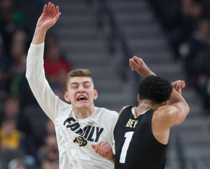 Colorado sophomore guard Tyler Bey (1) celebrates with sophomore guard AJ Martinka (12) after scoring in the first half during the Buffalo's Pac-12 semifinal game with Washington on Friday, March ...