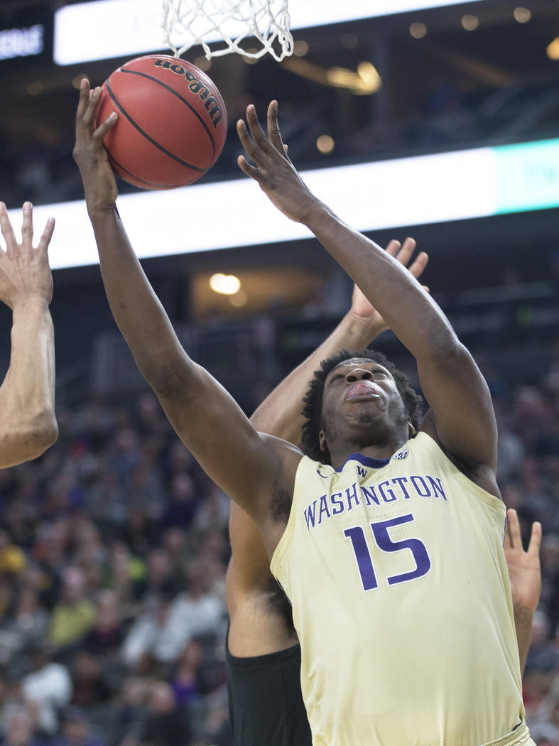 Washington senior forward Noah Dickerson (15) grabs a rebound in the second half during the Huskies Pac-12 semifinal game with Colorado on Friday, March 15, 2019, at T-Mobile Arena, in Las Vegas. ...