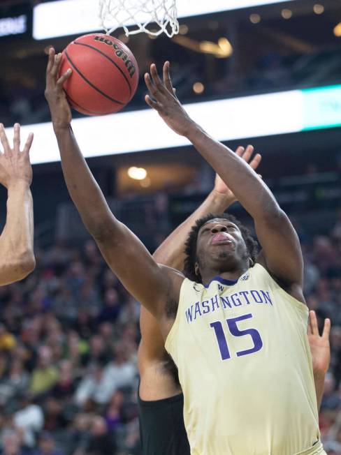 Washington senior forward Noah Dickerson (15) grabs a rebound in the second half during the Huskies Pac-12 semifinal game with Colorado on Friday, March 15, 2019, at T-Mobile Arena, in Las Vegas. ...