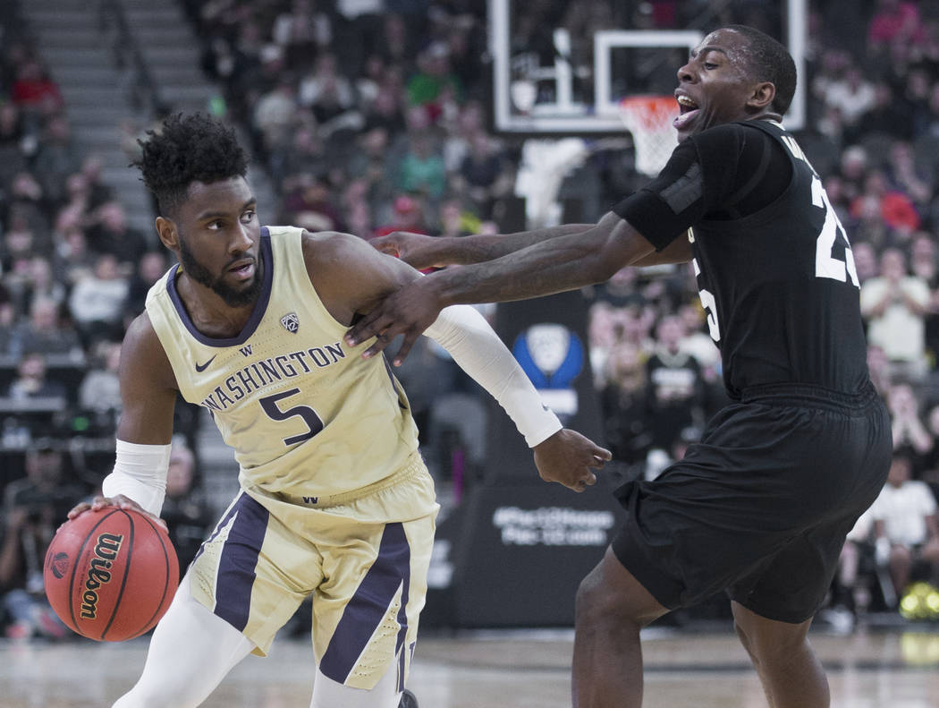 Washington sophomore guard Jaylen Nowell (5) drives past Colorado junior forward Lucas Siewert (23) in the second half during the semifinal game of the Pac-12 tournament on Friday, March 15, 2019, ...