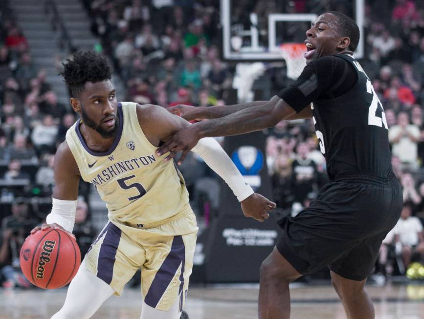 Washington sophomore guard Jaylen Nowell (5) drives past Colorado junior forward Lucas Siewert (23) in the second half during the semifinal game of the Pac-12 tournament on Friday, March 15, 2019, ...