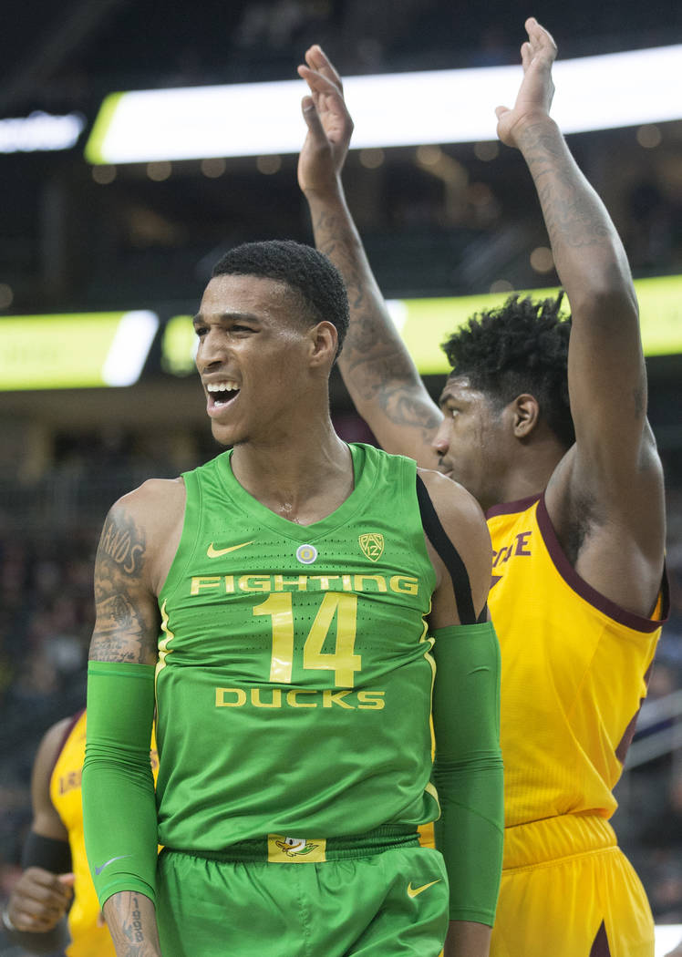 Oregon sophomore forward Kenny Wooten (14) looks at his bench after scoring in the second half during the semifinal game of the Pac-12 tournament with Arizona State on Friday, March 15, 2019, at T ...