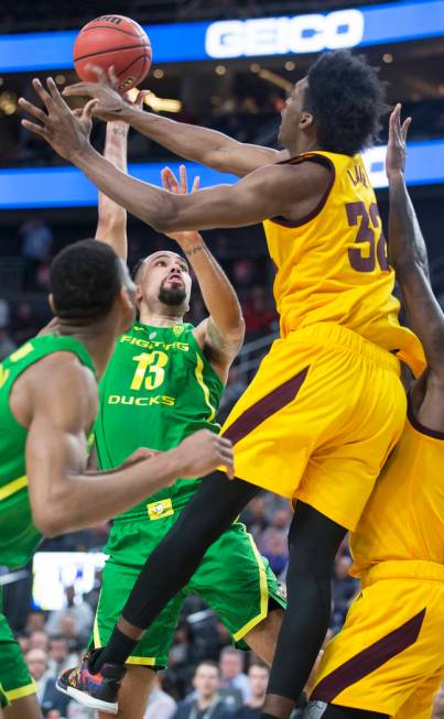 Oregon senior forward Paul White (13) shoots a jump shot over Arizona State senior forward De'Quon Lake (32) in the second half during the semifinal game of the Pac-12 tournament on Friday, March ...
