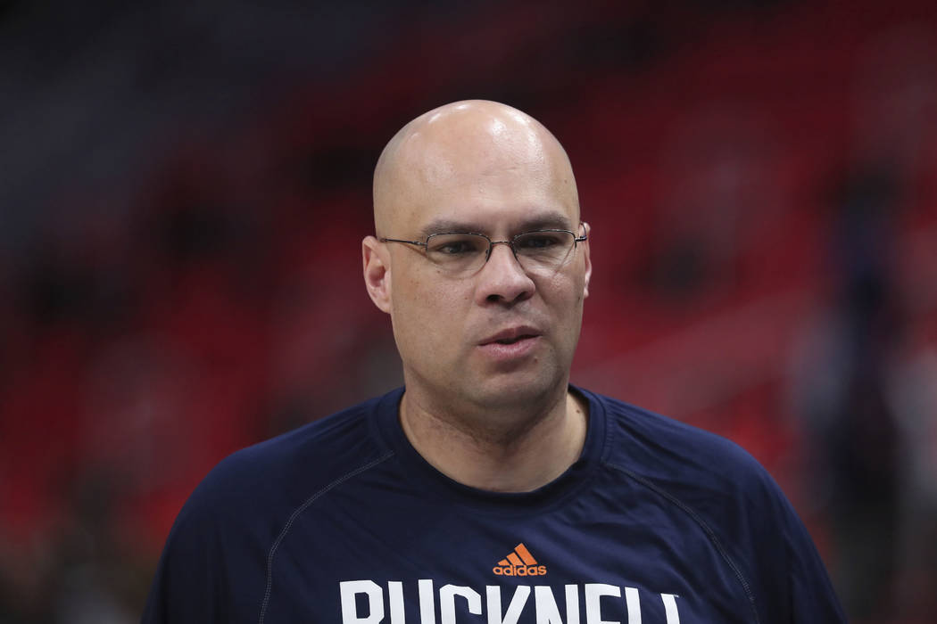 Bucknell head coach Nathan Davis walks off the court after a practice session for an NCAA men's college basketball tournament first-round game, Thursday, March 15, 2018, in Detroit. (AP Photo/Carl ...