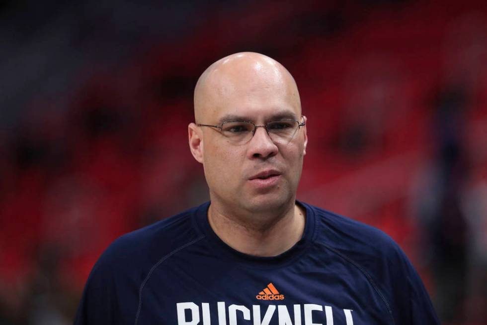 Bucknell head coach Nathan Davis walks off the court after a practice session for an NCAA men's college basketball tournament first-round game, Thursday, March 15, 2018, in Detroit. (AP Photo/Carl ...