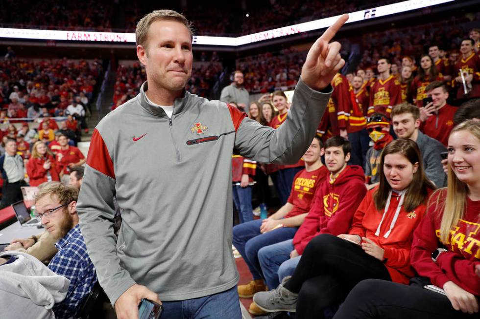 Former Iowa State head coach Fred Hoiberg points to fans as he walks by during the first half of the Iowa State NCAA college basketball game against Baylor, Tuesday, Feb. 19, 2019, in Ames, Iowa. ...