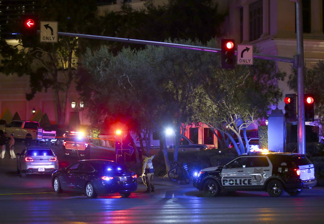 Las Vegas police officers investigate outside of the north valet at the Bellagio after police fired at a robbery suspect in Las Vegas on Friday, March 15, 2019. (Chase Stevens/Las Vegas Review-Jou ...