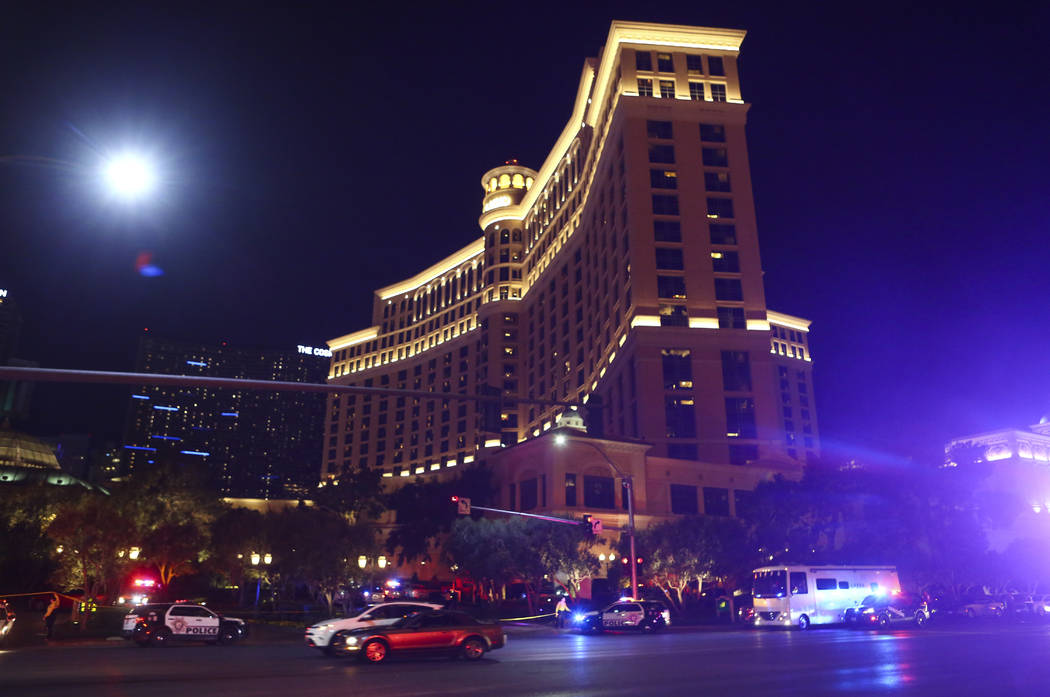 Las Vegas police officers investigate outside of the north valet at the Bellagio after police fired at a robbery suspect in Las Vegas on Friday, March 15, 2019. (Chase Stevens/Las Vegas Review-Jou ...