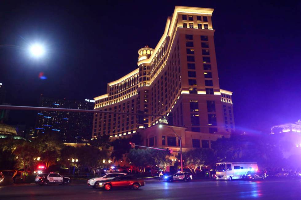 Las Vegas police officers investigate outside of the north valet at the Bellagio after police fired at a robbery suspect in Las Vegas on Friday, March 15, 2019. (Chase Stevens/Las Vegas Review-Jou ...