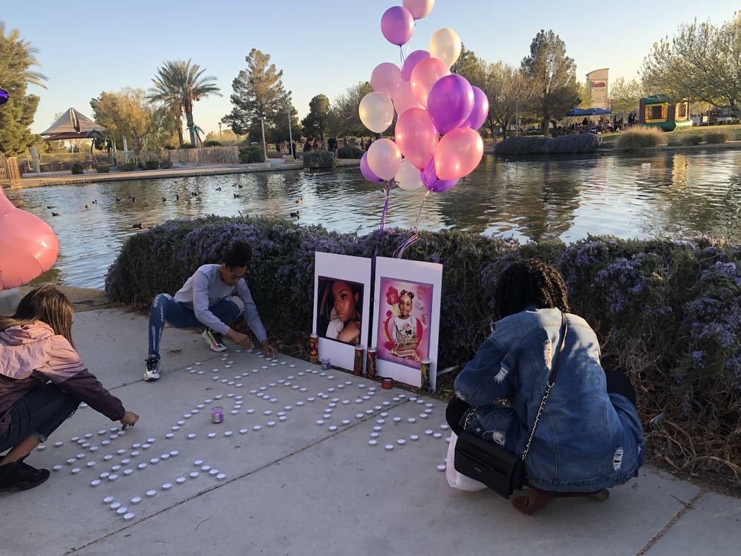 Women light candles during a vigil on Saturday, March 16, 2019, in North Las Vegas for Sierra Robinson, 24, and her daughter, 2-year-old Noelani Robinson. Police said Sierra Robinson, of Las Vegas ...