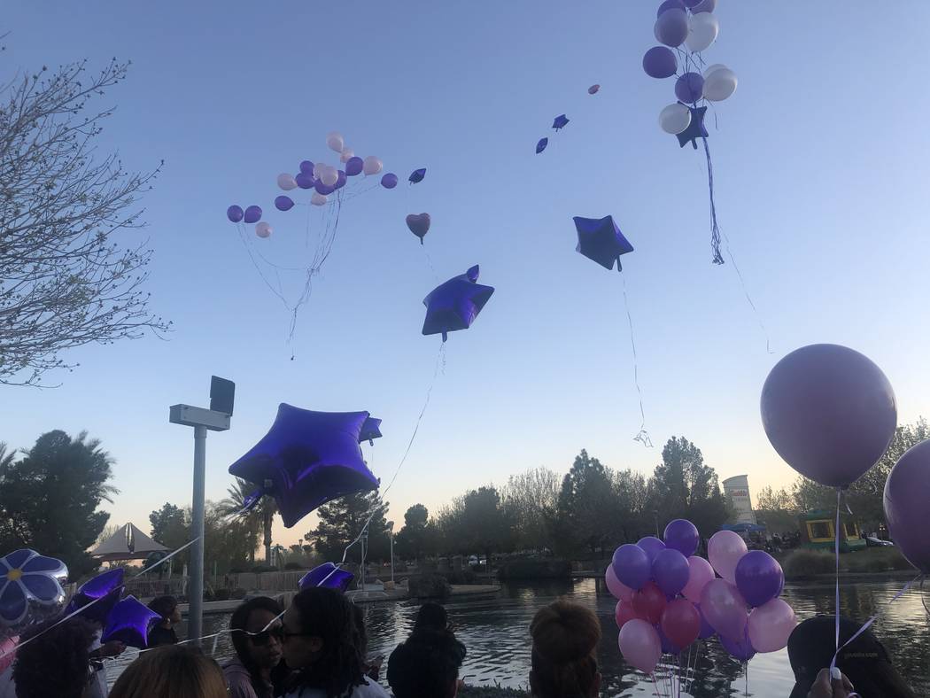 People release purple balloons during a vigil on Saturday, March 16, 2019, in North Las Vegas for Sierra Robinson, 24, and her daughter, 2-year-old Noelani Robinson. Police said Sierra Robinson, o ...