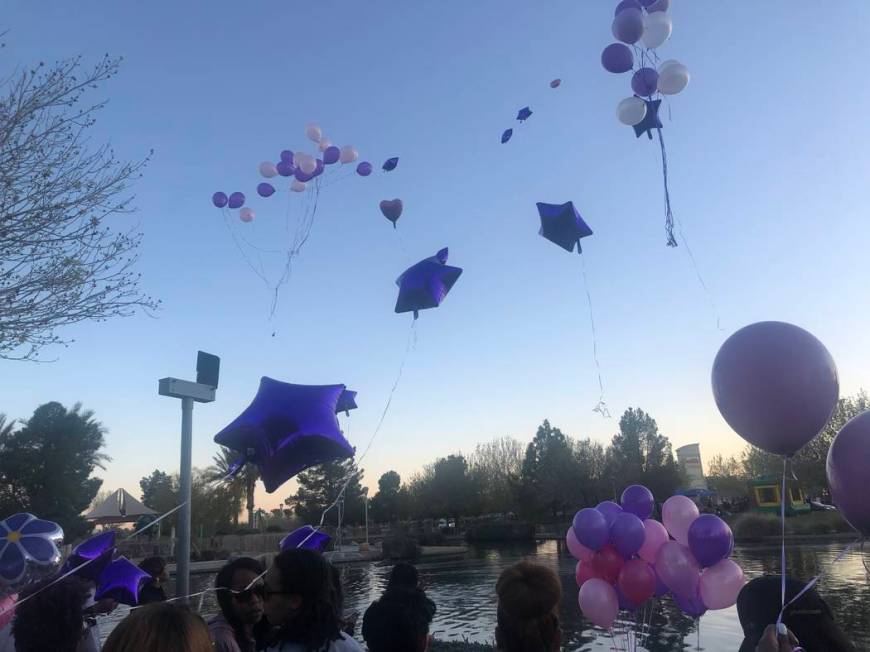 People release purple balloons during a vigil on Saturday, March 16, 2019, in North Las Vegas for Sierra Robinson, 24, and her daughter, 2-year-old Noelani Robinson. Police said Sierra Robinson, o ...