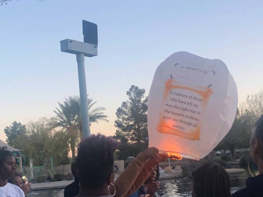 Someone prepares to release a lantern during a vigil on Saturday, March 16, 2019, in North Las Vegas for Sierra Robinson, 24, and her daughter, 2-year-old Noelani Robinson. The lantern reads &quot ...