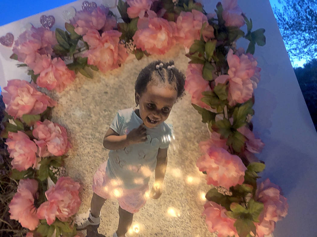 Candles illuminated a picture of 2-year-old Noelani Robinson during a vigil on Saturday, March 16, 2019, in North Las Vegas for the girl and her mother, Sierra Robinson, 24. Police said Sierra Rob ...