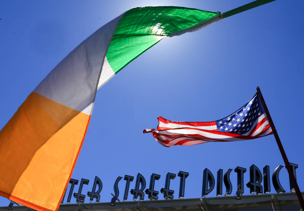 Irish and American flags flutter in the wind at the 53rd Annual Southern Nevada Sons & Daughters of Erin St. Patrick's Day parade in Henderson, Nev., on Saturday, March 16, 2019. Brett Le Blan ...