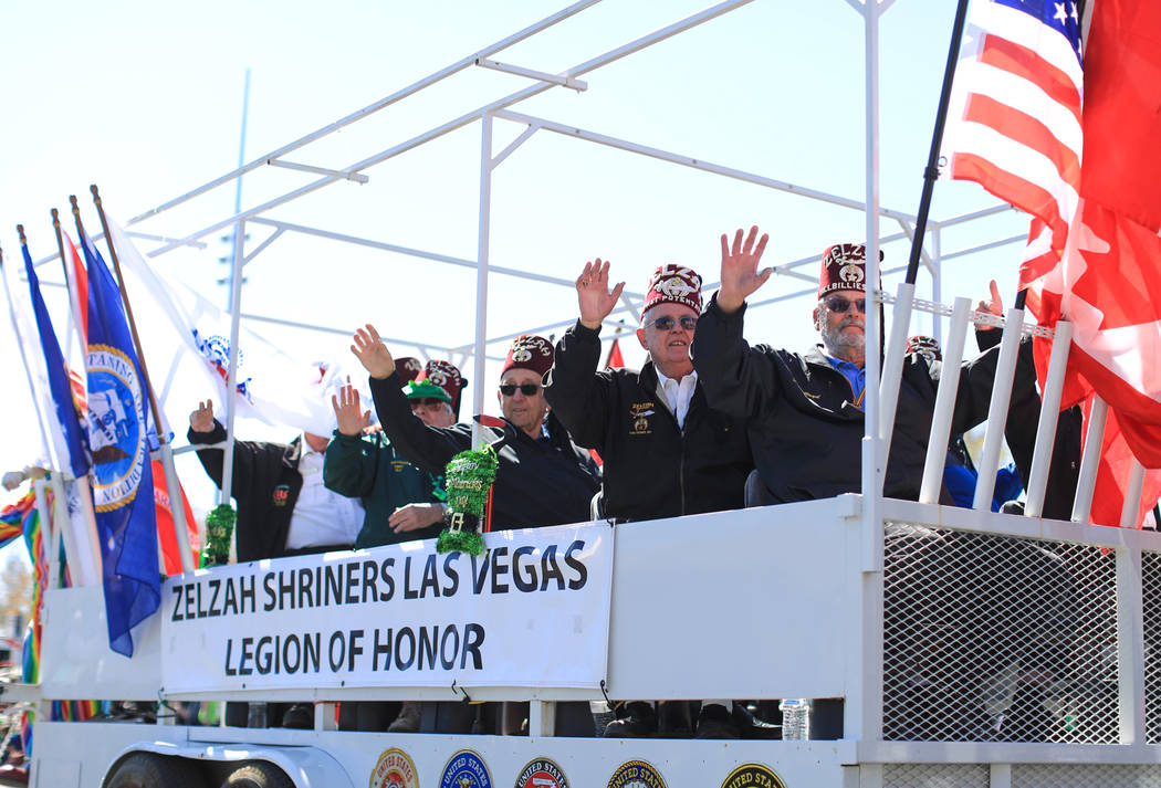 The Zelzah Shriners Las Vegas Legion of honor waves to the crowd in the 53rd Annual Southern Nevada Sons & Daughters of Erin St. Patrick's Day parade in Henderson, Nev., on Saturday, March 16, ...