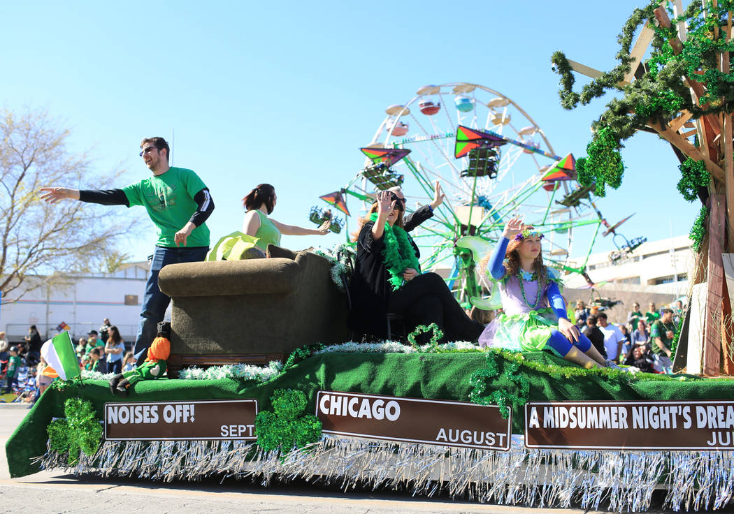 The Super Summer Theatre float passes in front of the fair rides at the 53rd Annual Southern Nevada Sons & Daughters of Erin St. Patrick's Day parade in Henderson, Nev., on Saturday, March 16, ...