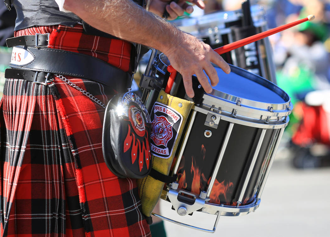 A drummer with the Las Vegas Emerald Society march in the 53rd Annual Southern Nevada Sons & Daughters of Erin St. Patrick's Day parade in Henderson, Nev., on Saturday, March 16, 2019. The Eme ...