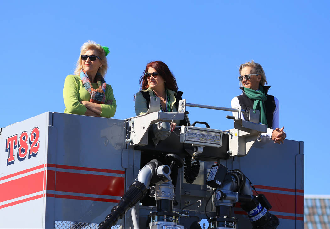 Henderson city mayor Debra March, middle, rides in fire truck in the 53rd Annual Southern Nevada Sons & Daughters of Erin St. Patrick's Day parade in Henderson, Nev., on Saturday, March 16, 20 ...