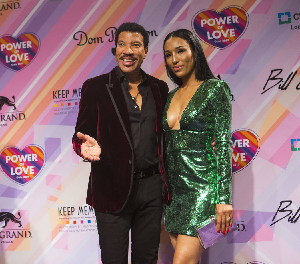 Lionel Richie, left, and his girlfriend, Lisa Parigi, pose on the red carpet for Keep Memory Alive's 23rd annual Power of Love gala, raising money for Cleveland Clinic Lou Ruvo Center for Brain He ...