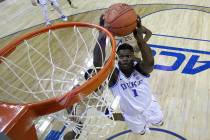 Duke's Zion Williamson (1) goes up to dunk against Florida State during the first half of the NCAA college basketball championship game of the Atlantic Coast Conference tournament in Charlotte, N. ...