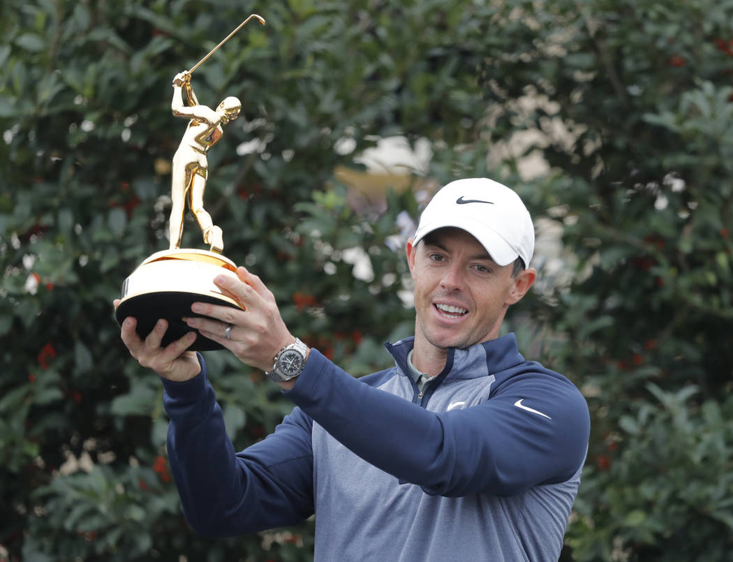 Rory McIlroy, of Northern Ireland, poses with the trophy after winning The Players Championship golf tournament Sunday, March 17, 2019, in Ponte Vedra Beach, Fla. (AP Photo/Gerald Herbert)