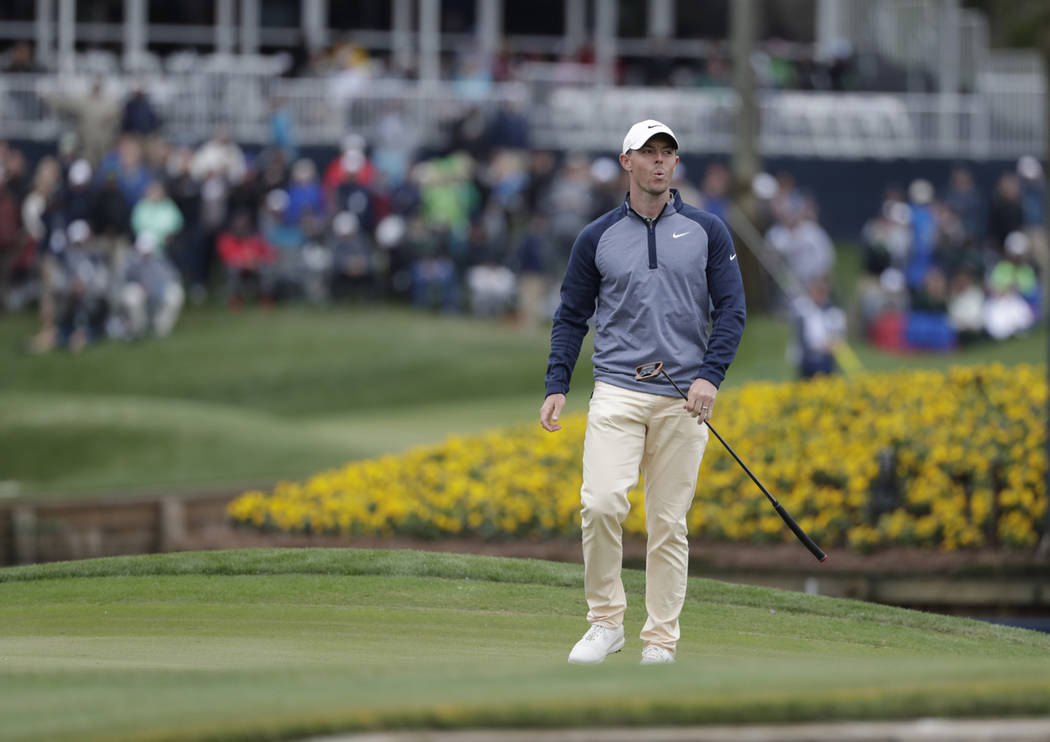 Rory McIlroy, of Northern Ireland, reacts to his putt on the 17th green during the final round of The Players Championship golf tournament Sunday, March 17, 2019, in Ponte Vedra Beach, Fla. (AP Ph ...