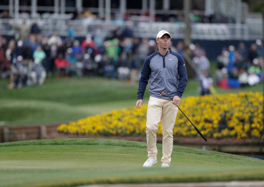 Rory McIlroy, of Northern Ireland, reacts to his putt on the 17th green during the final round of The Players Championship golf tournament Sunday, March 17, 2019, in Ponte Vedra Beach, Fla. (AP Ph ...