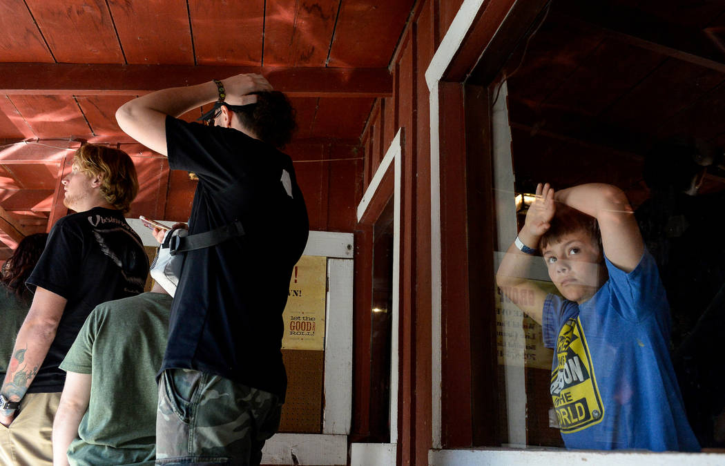 Daniel Buddle, 11, looks out through a window at the Restaurant Bar and Lounge during the last day of operations at Bonnie Springs Ranch in Las Vegas, Sunday, March 17, 2019. (Caroline Brehman/Las ...