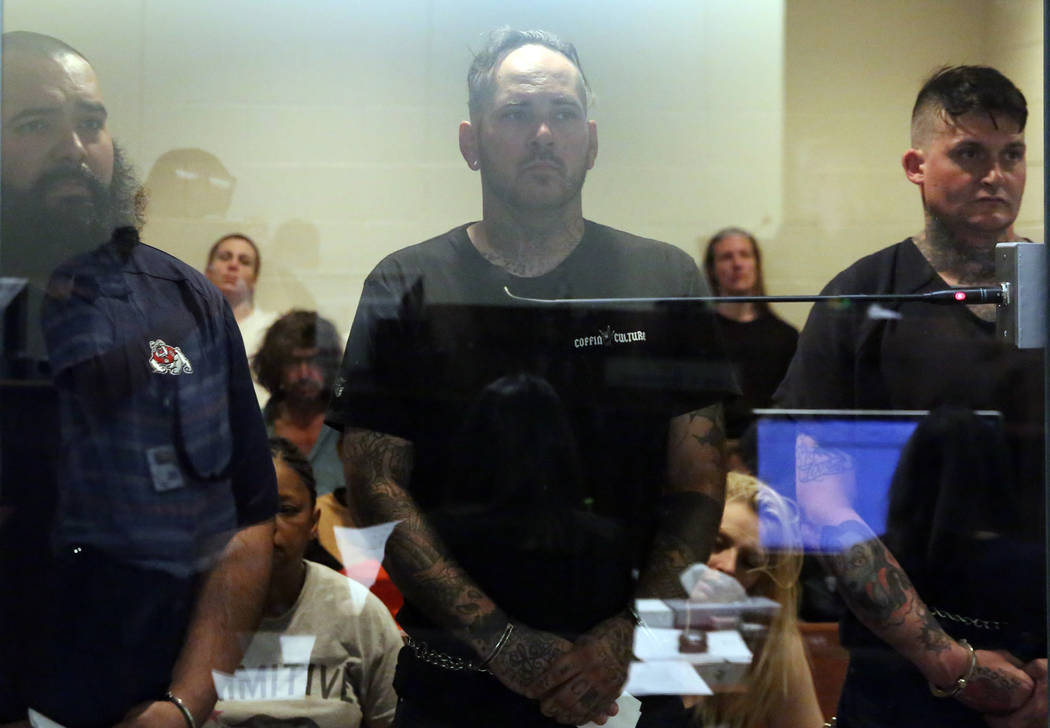 Roberto Romero, 30, left, Travis Callahan, 35, and Matthew Norris, 34, appear in court at the Regional Justice Center on Monday, March. 18, 2019, in Las Vegas. The three face several charges after ...