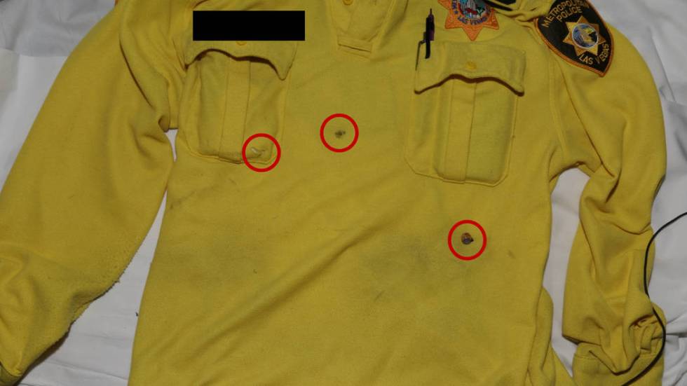 This photo released by the Las Vegas Metropolitan Police Department shows the shirt worn by a Las Vegas police officer who was shot following an armed robbery at the Bellagio on March 15, 2019. Mi ...